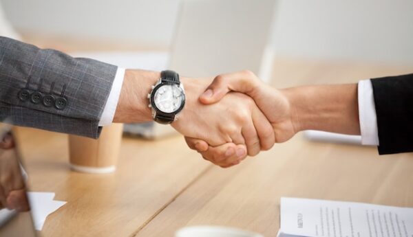 closeup-view-handshake-two-businessmen-suits-shaking-hands_1163-4891